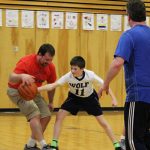A Wolf student steals the ball from a parent