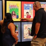 Students share their artwork with friends and family