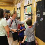 Room 3 students show their mobiles to visitors