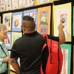 Family members and friends join students on May 3rd for the annual art show