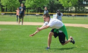 A student tries to catch the ball