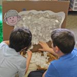 Students work together at the Shear the Sheep station