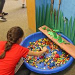 A student at the I Spy pond activity